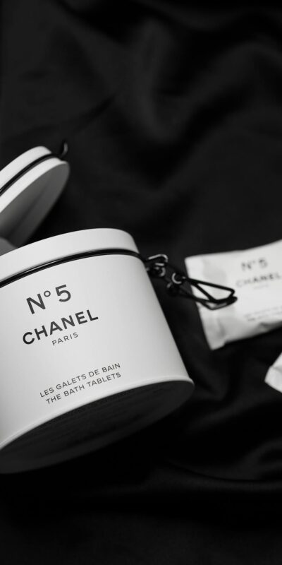 Elegant, high-end Chanel No 5 bath tablets displayed on a black background, perfect for luxurious promotions.