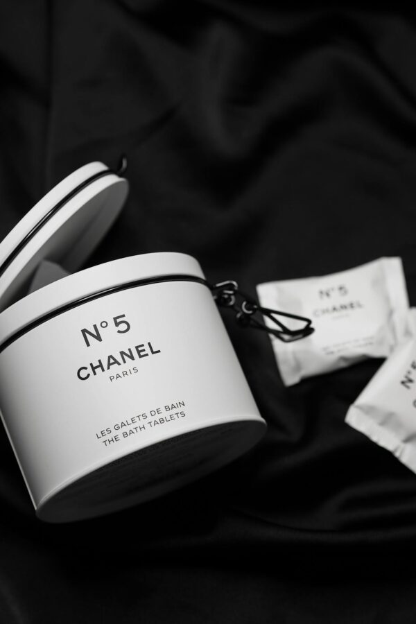 Elegant, high-end Chanel No 5 bath tablets displayed on a black background, perfect for luxurious promotions.